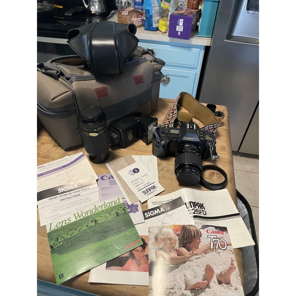 Vintage working Canon T70 Camera With 2 Lenses, Flash, Manual And Case